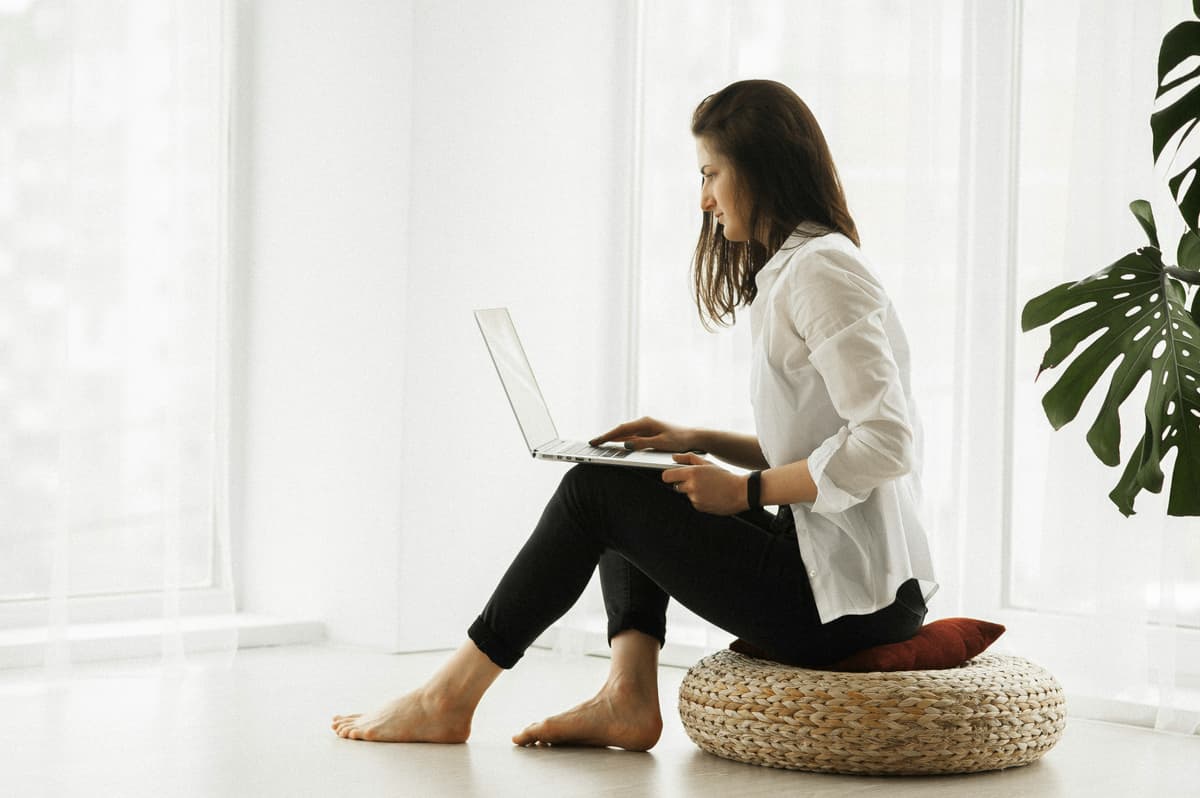 A telehealth therapy session on a laptop.